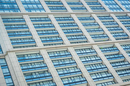 Beautiful exterior of business building with glass window pattern in the city