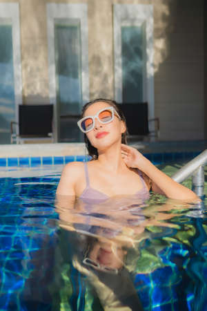 Portrait beautiful young asian woman relax leisure enjoy around outdoor swimming pool in vacation