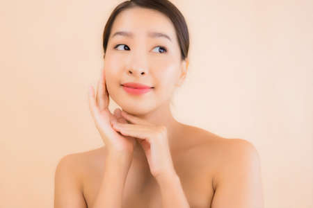 Portrait beautiful young asian sport woman with sportwear ready for exercise on yellow isolated backgroundの写真素材
