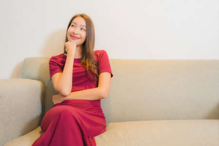 Portrait beautiful young asian woman smile relax leisure on bed in bedroom interior