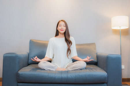 Portrait beautiful young asian woman relax smile leisure around outdoor swimming pool in hotel and resortの写真素材