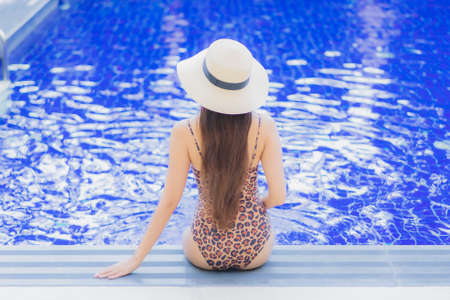 Portrait beautiful young asian woman use smart mobile phone on bed in bedroom interiorの写真素材