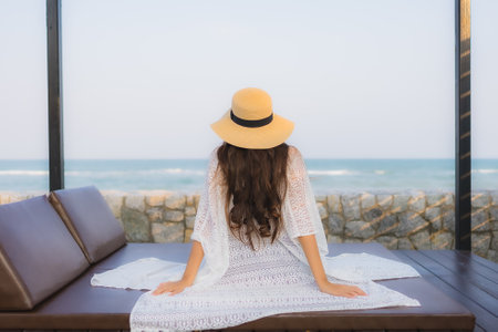 Portrait beautiful young asian woman relax smile leisure around outdoor tropical sea beach ocean in travel vacationの写真素材