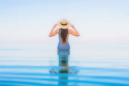 Portrait beautiful young asian woman relax smile leisure around outdoor tropical sea beach ocean in travel vacationの写真素材