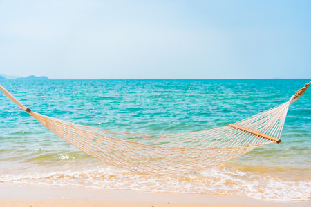 Portrait beautiful young asian woman smile relax leisure around outdoor swimming pool with city viewの写真素材