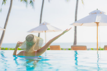 Portrait beautiful young asian woman with grocery basket from supermarket on color isolated backgroundの写真素材
