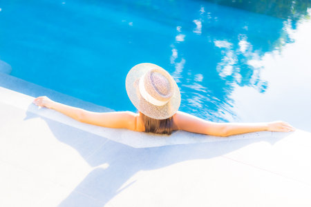 Portrait beautiful young asian woman smile with action on yellow isolated backgroundの写真素材
