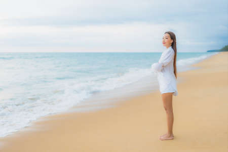 Portrait beautiful young asian woman relax smile around beach sea ocean in holiday vacationの写真素材