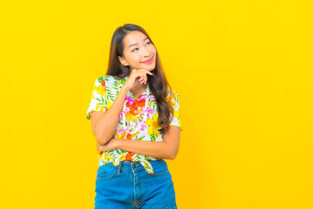 Portrait beautiful young asian woman wear colorful shirt backpacker or luggage ready for travelの写真素材