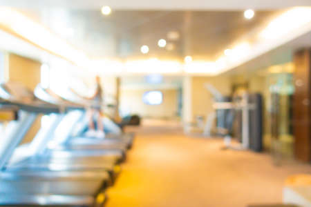 Abstract blur fitness equipment in gym room interior for backgroundの写真素材