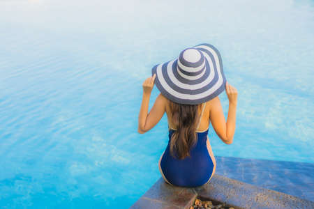 Portrait beautiful young asian woman relax around swimming pool in hotel resort for leisure in vacationの写真素材