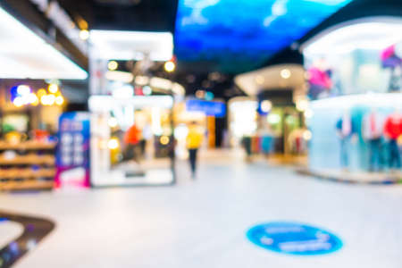 Abstract blur and defocus shopping mall and retail in department store interior for backgroundの写真素材
