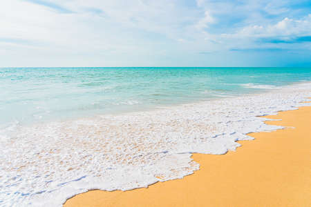 Beautiful tropical beach sea ocean with white cloud and blue sky for nature background