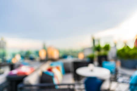 Abstract blur restaurant and cafe bar on rooftop around city for backgroundの写真素材