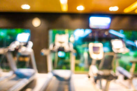 Abstract blur fitness equipment in gym room interior for backgroundの写真素材