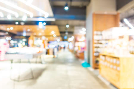 Abstract blur defocus shopping mall and retails of department store interior for backgroundの写真素材
