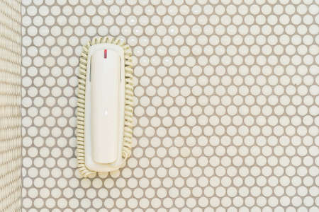 White telephone or phone on wall decoration interior of roomの写真素材