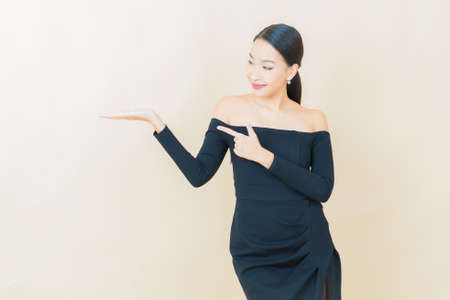 Portrait beautiful young asian woman smile with action on color backgroundの写真素材