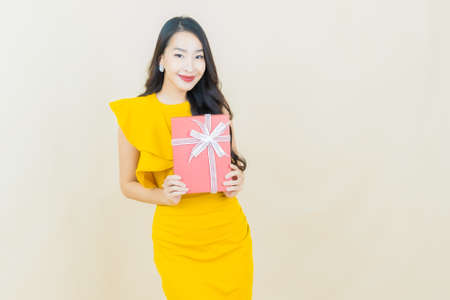 Portrait beautiful young asian woman smile with action on color backgroundの写真素材