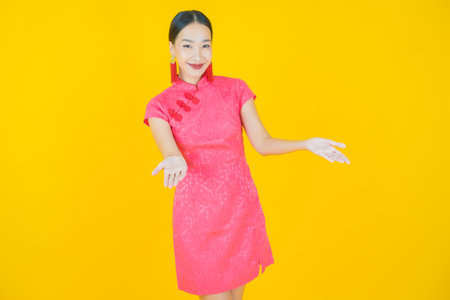 Portrait beautiful young asian woman smile with action on color backgroundの写真素材
