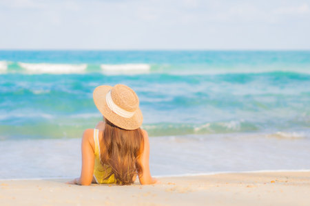 Portrait beautiful young asian woman relax smile leisure around beach sea ocean on travel vacation tripの写真素材