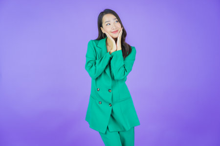 Portrait beautiful young asian woman smile with action on color backgroundの写真素材