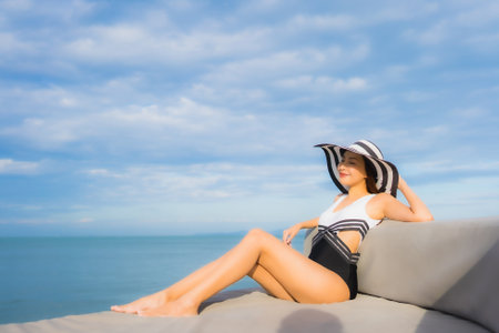 Portrait beautiful young asian women relax smile happy around sea beach ocean for vacation travel in holidayの写真素材