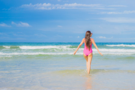 Portrait beautiful young asian woman relax smile around beach sea ocean in holiday vacation travel tripの写真素材