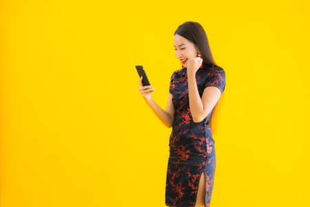 Portrait beautiful young asian woman smile with action on color backgroundの写真素材