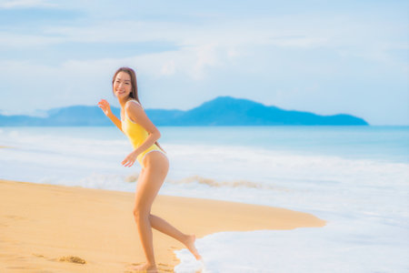 Portrait beautiful young asian woman relax smile leisure around outdoor tropical sea beach ocean in travel vacationの写真素材