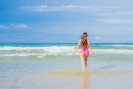 Portrait beautiful young asian woman relax smile around beach sea ocean in holiday vacation travel tripの写真素材