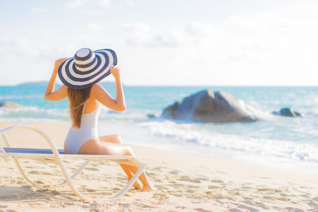 Portrait beautiful young asian woman relax smile leisure around beach sea ocean on travel vacation tripの写真素材
