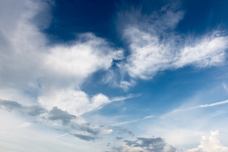 white and blue could in the skyの写真素材
