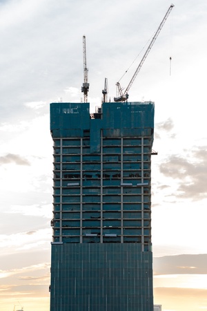Construction site with crane and building in bangkok thailandの写真素材