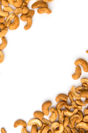 Cashew lying on white paper can use as background or frameの写真素材