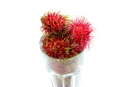 Tropical fruit, rambutan  in glass on white backgroundの写真素材
