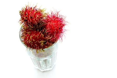 Tropical fruit, rambutan  in glass on white backgroundの写真素材