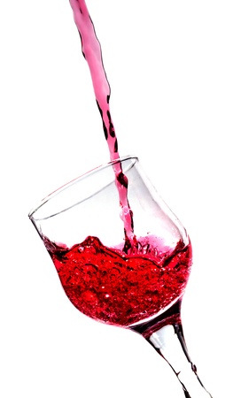 Splash in a red wine glass isolatedの写真素材