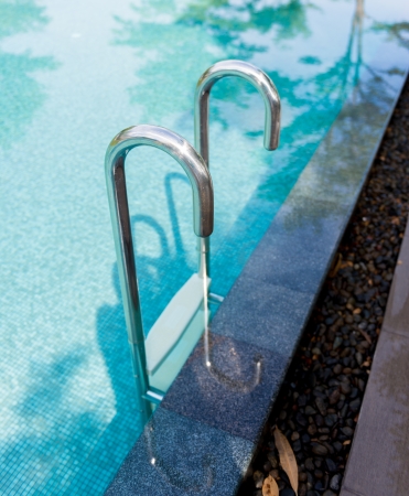 the swimming pool with steel ladderの写真素材