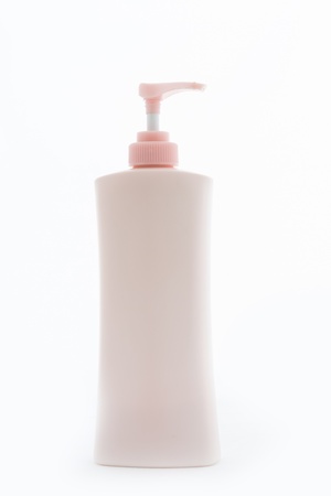 Pink Plastic bottle of skin care product on white backgroundの写真素材