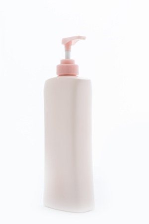 Pink Plastic bottle of skin care product on white backgroundの写真素材