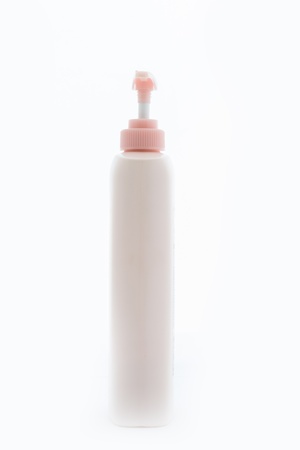 Pink Plastic bottle of skin care product on white backgroundの写真素材