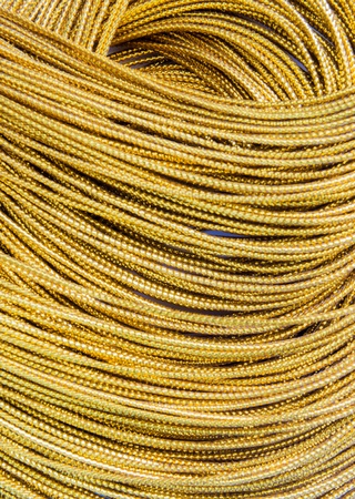Close up Gold braid For crafts on white backgroundの写真素材
