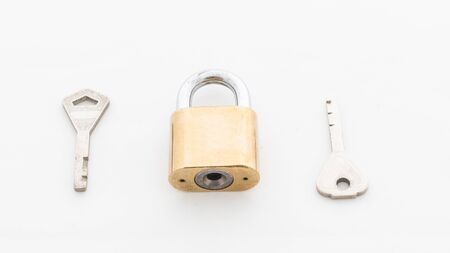 Padlock with key on white backgroundの写真素材