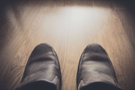 brown shoes on wood background view from aboveの写真素材