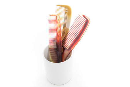 Brown Hair Comb on white backgroundの写真素材