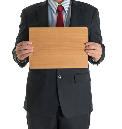 businessman hands showing wooden blank board on white background isolatedの写真素材