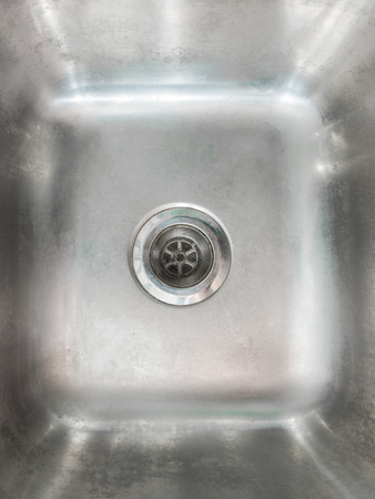 Stainless steel sink plug hole close up の写真素材