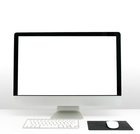 Office desk with the PC and White wallの写真素材