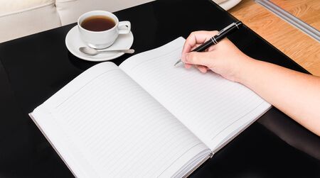 man brainstorming about branding strategy and coffee cupの写真素材
